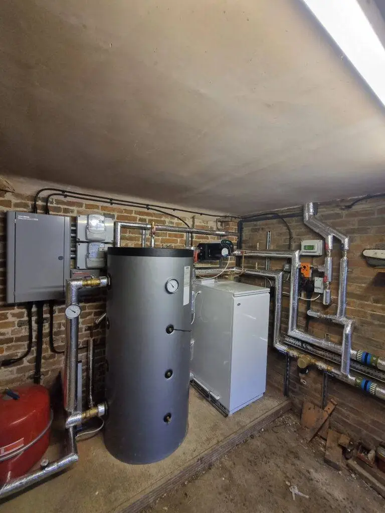 image of the basement plant room for ASHP equipment including cylinder